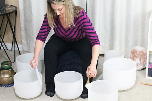 Nicole Lawler playing the crystal singing bowls.