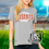 Thumbnail: custom glitter football t-shirt for her in the color athletic grey