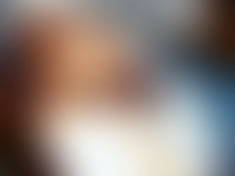 Woman drinking morning coffee outside in natural light, enjoying a mindful morning habit for sustainable New Year change