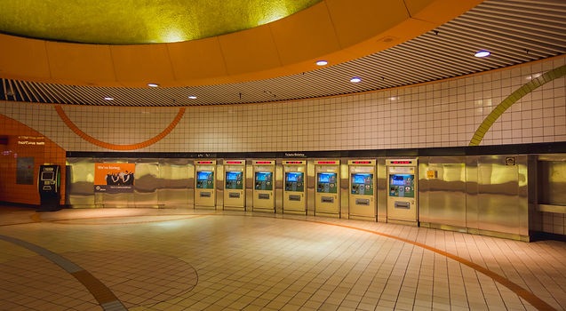 Empty subway station with several ticket machines