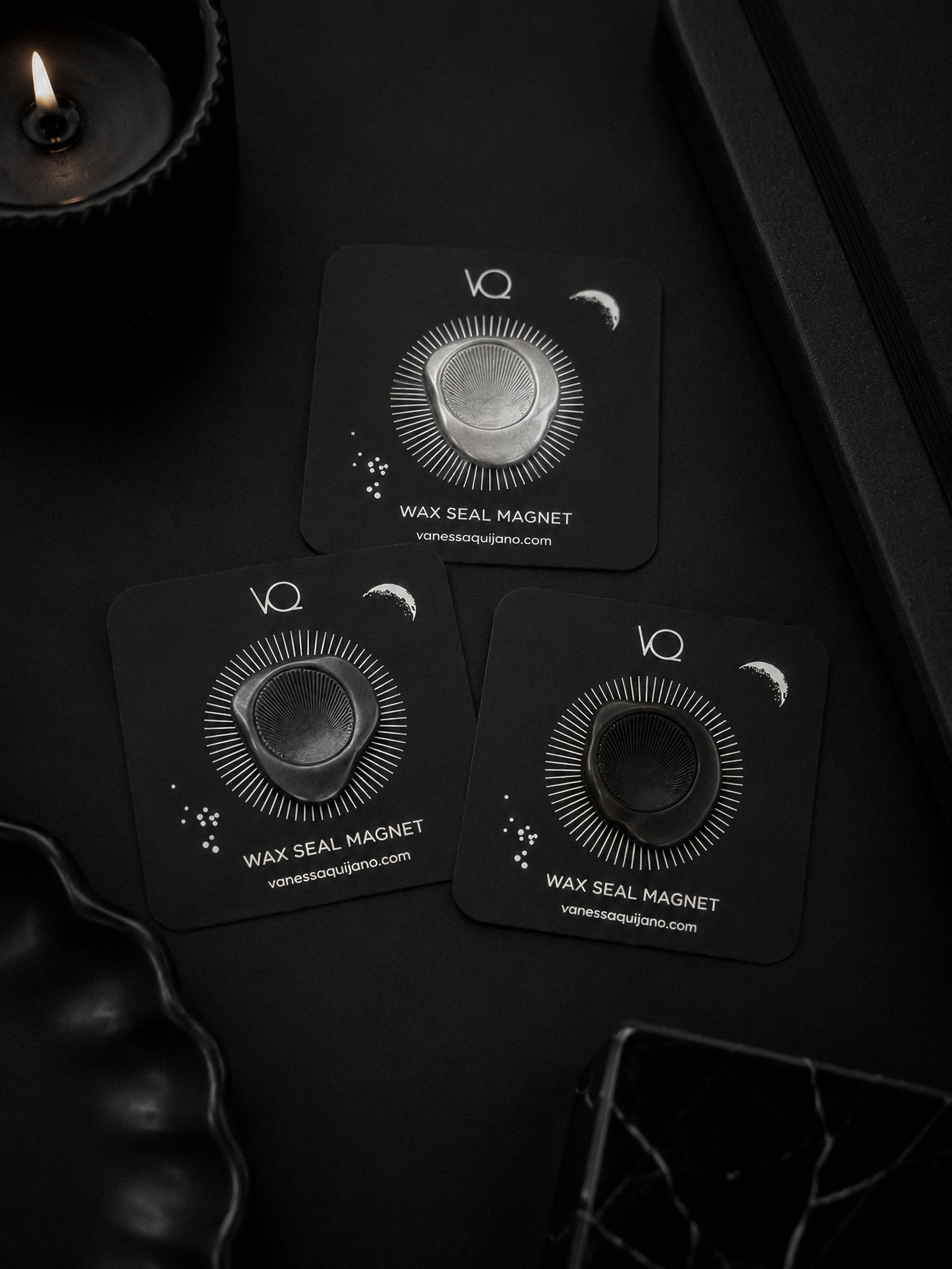 Sun wax seal magnet collection featuring Silver, Charcoal and Onyx finishes displayed on black luxury stationery.
