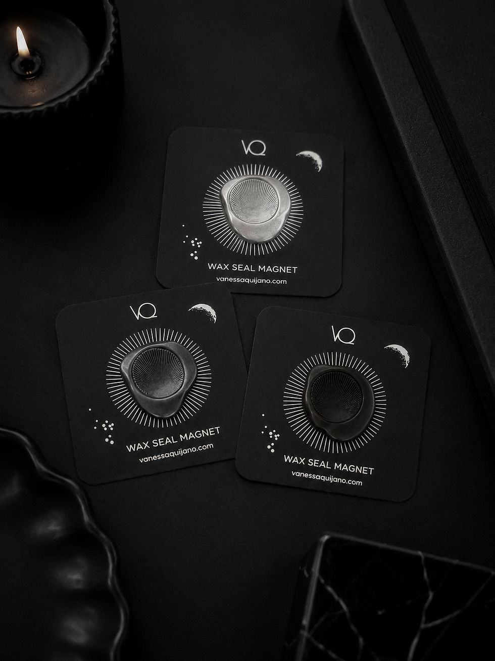 Sun wax seal magnet collection featuring Silver, Charcoal and Onyx finishes displayed on black luxury stationery.