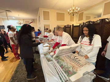Volunteers delivering many holiday gifts