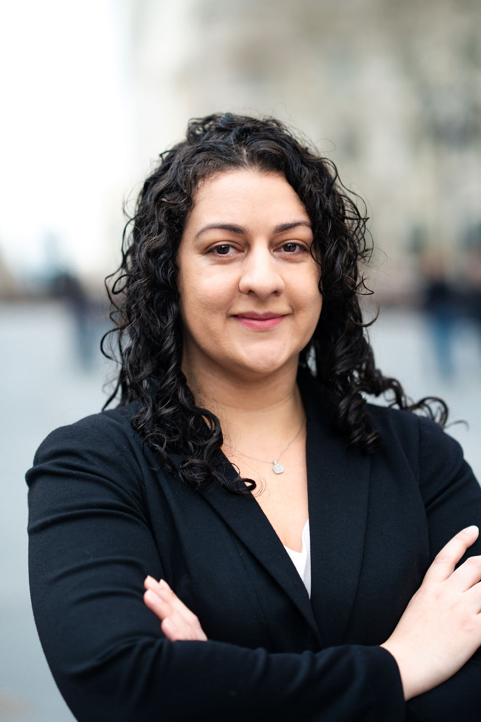 Portrait of Maryory Baez, experienced family law attorney at M. Baez Law, smiling and wearing professional attire.