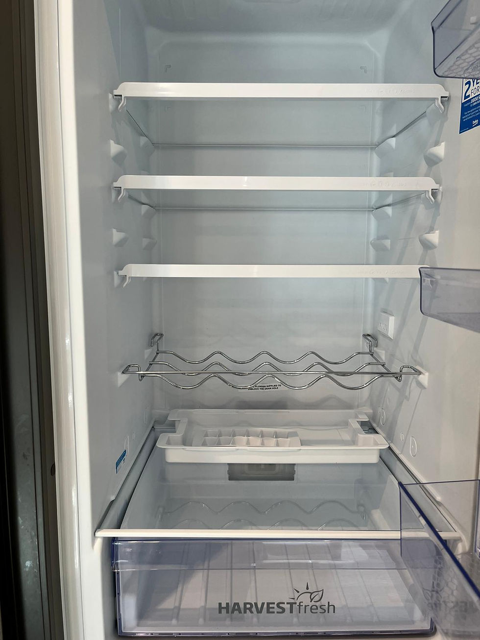 Clean and empty refrigerator shelves and drawers
