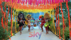 Tropicalia Rio drummers and carnival dancers performing at SKY day