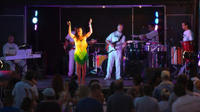 Tropicalia Brazilian band on stage at Brazilian outdoor event