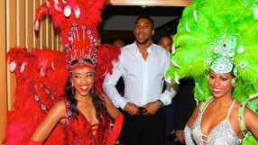 Tropicalia carnival dancers escorting British boxing champion Anthony Joshua