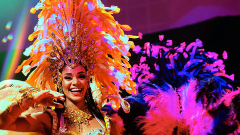 Tropicalia Brazilian dancer smiling at camera during a corporate event