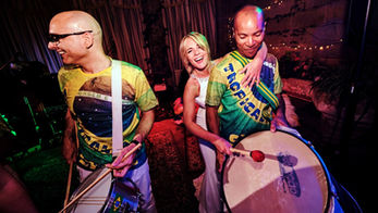 Wedding guests dancing to Rio drummers and samba performers