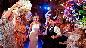 Groom & Bride dancing with Tropicalia carnival performers during wedding