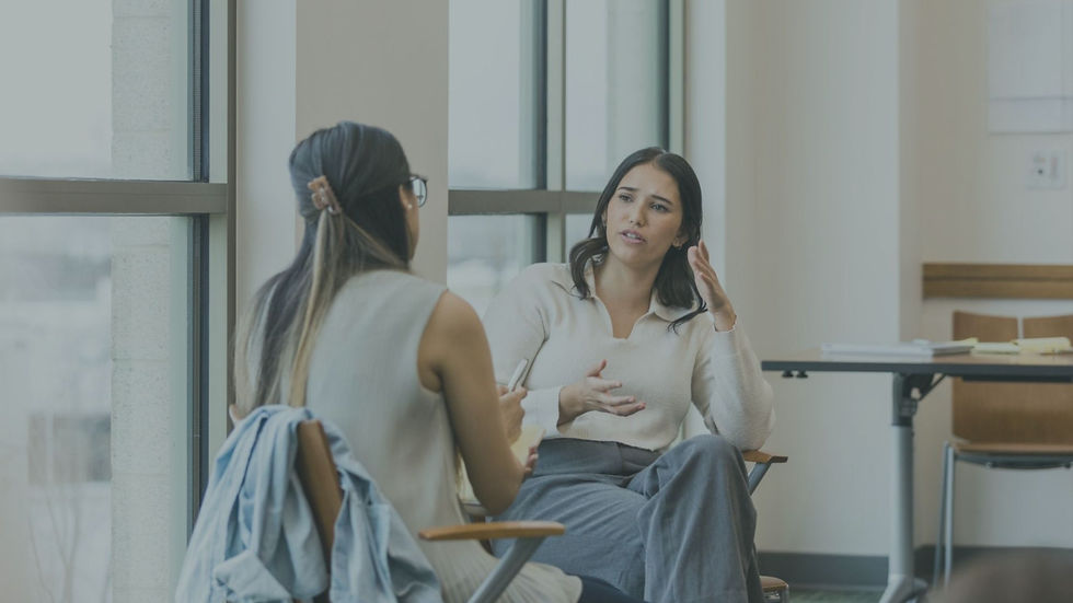 Person speaking with a therapist in a calm setting, representing seeking help for depression.