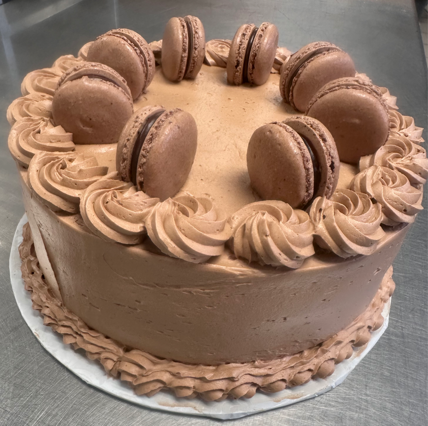 Chocolate cake with chocolate French macarons