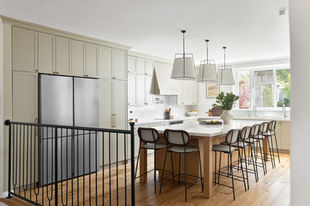 a kitchen with white cabinets and a samsung refrigerator