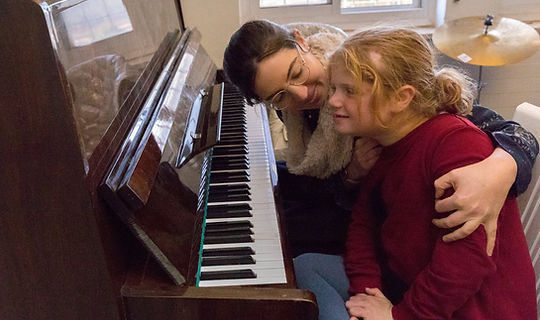 Music TherGirl having a music therpay sessiony