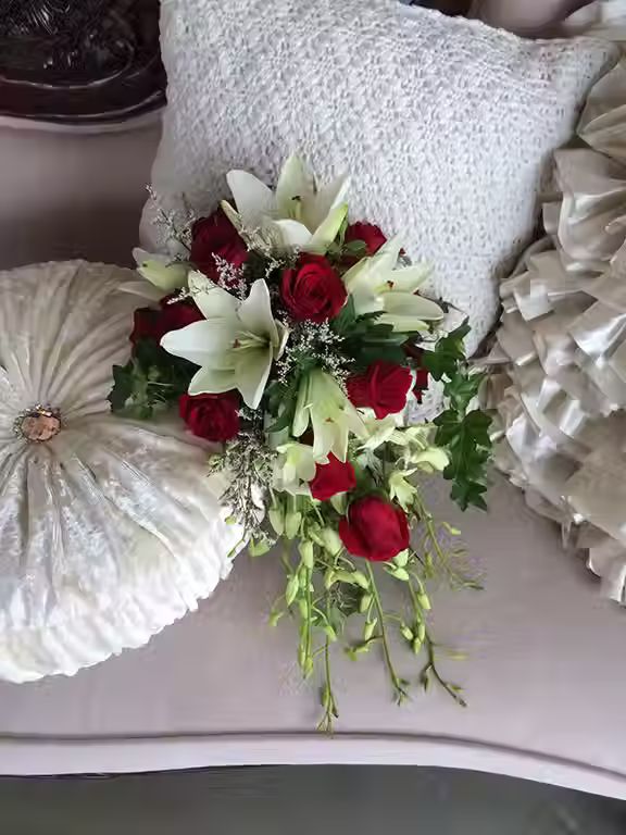 Price: $200.00
The cascade bouquet combines lilies, roses, dendrobium orchids, and misty white for a classic look.