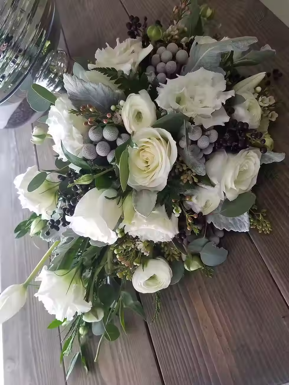 Price: $175.00
To achieve that soft winter feel we used roses, lisianthus, silver brunia, ranunculus, seeded eucalyptus, and privit berry (seasonal).