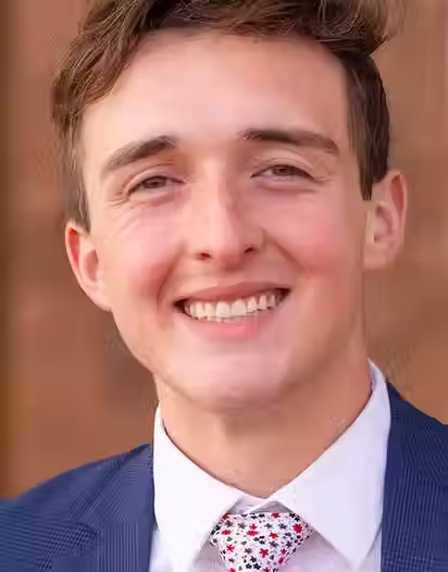 Evan Thomas - Headshot (1).avif