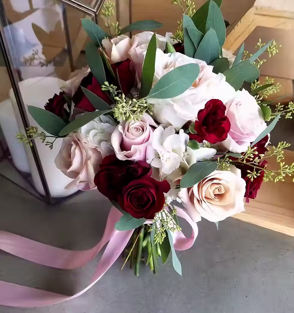 Price $165.00
To achieve a unique contrast, this bouquet uses pixie carnations, Quicksand and Pink Mondial roses, Rubicon spray roses, hydrangea, and seeded eucalyptus.