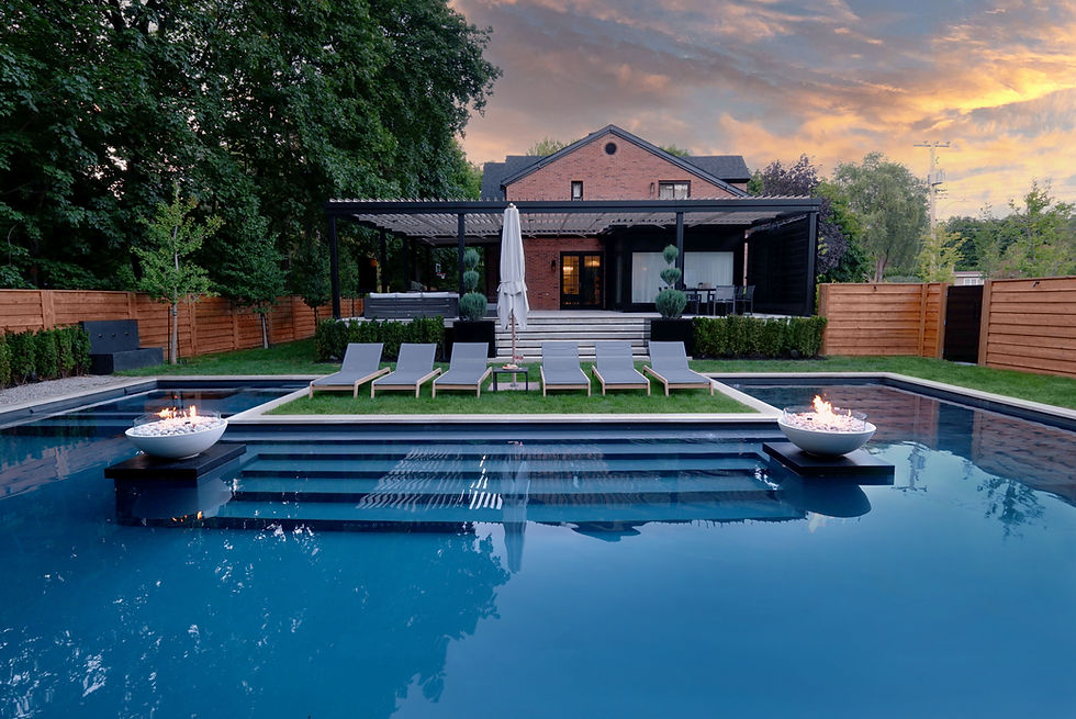 Luxury backyard transformation featuring custom concrete pool, landscape design, and outdoor living spaces