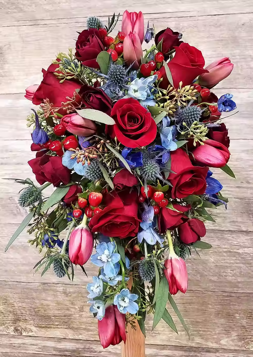 Price: $200.00
This bouquet includes tulips, roses, spray roses, delphinium, eryngium, and a mix of eucalyptus.