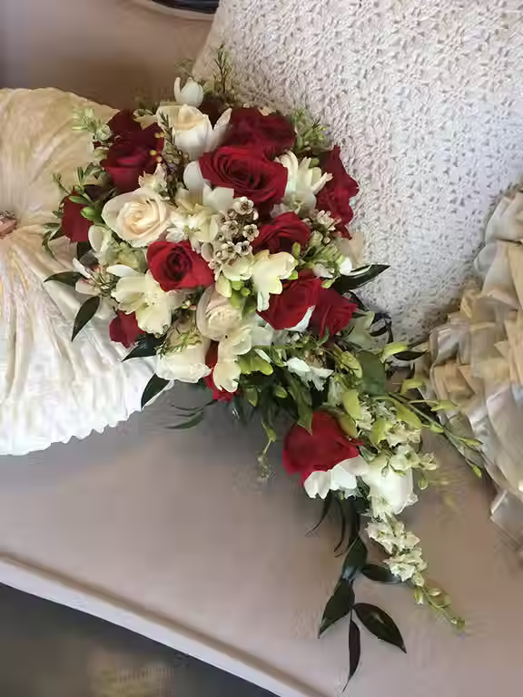 Price: $200.00
This classic combination of roses, freesia, waxflower and larkspur will look beautiful at any wedding.