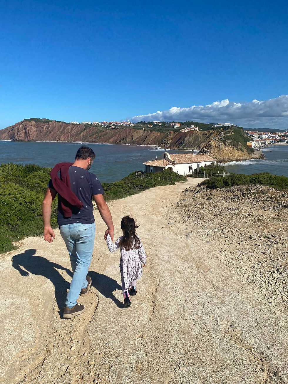 Father and daughter walking towards the Capela de Sant'Ana in Salir do Porto
