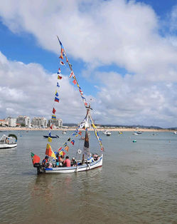 Traditional boat procession in Sao Martinho do Porto Portugal