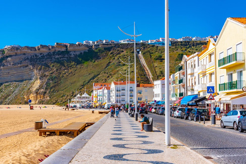 Traditional calçada boardwalk next to the beach in Nazare Portugal