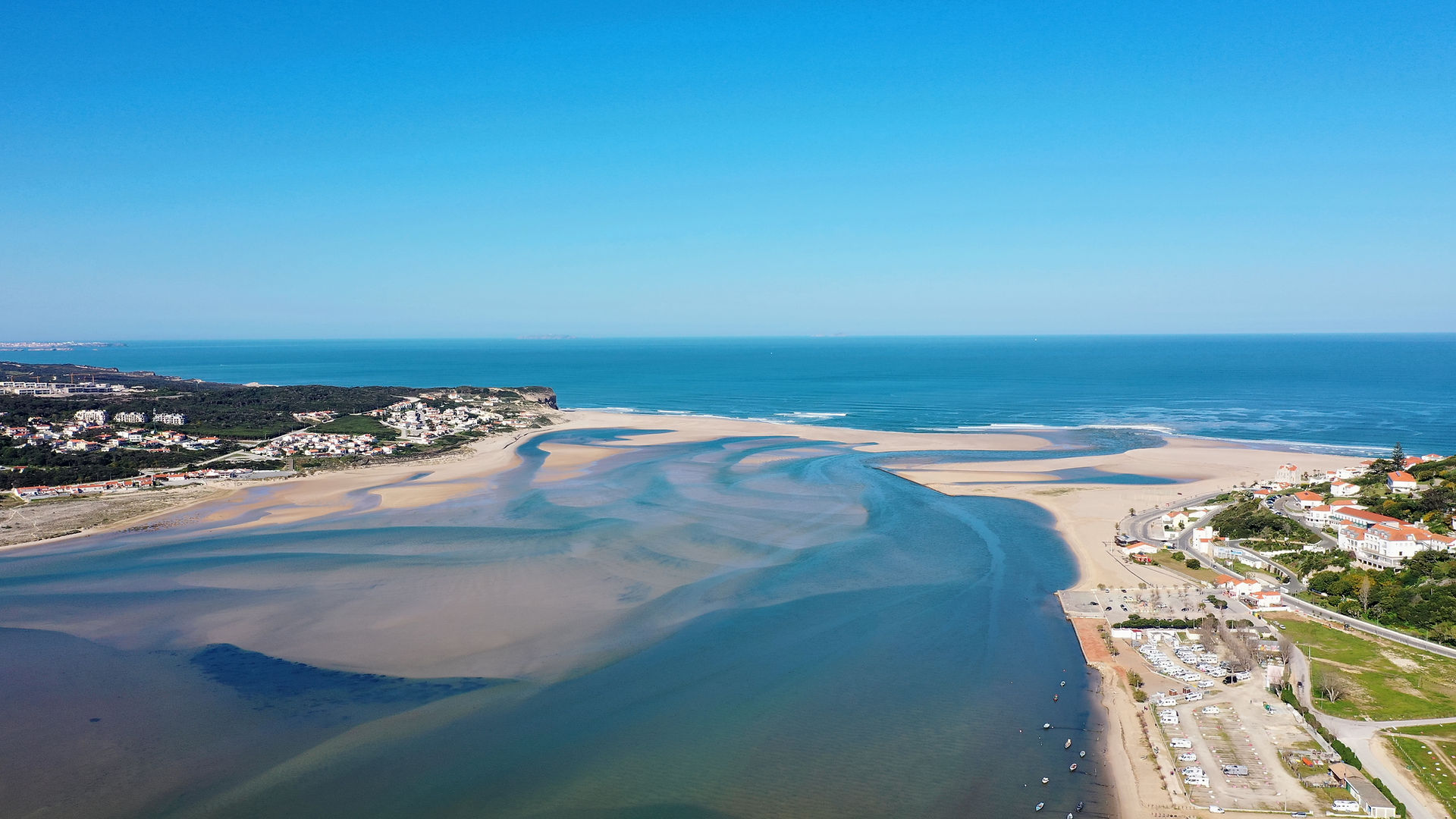 Aerial view of Foz do Arelho Beach opening to Obidos Lagoon