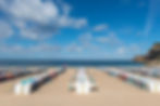 cloth beach tents at Nazare beach in Portugal and the Atlantic Ocean
