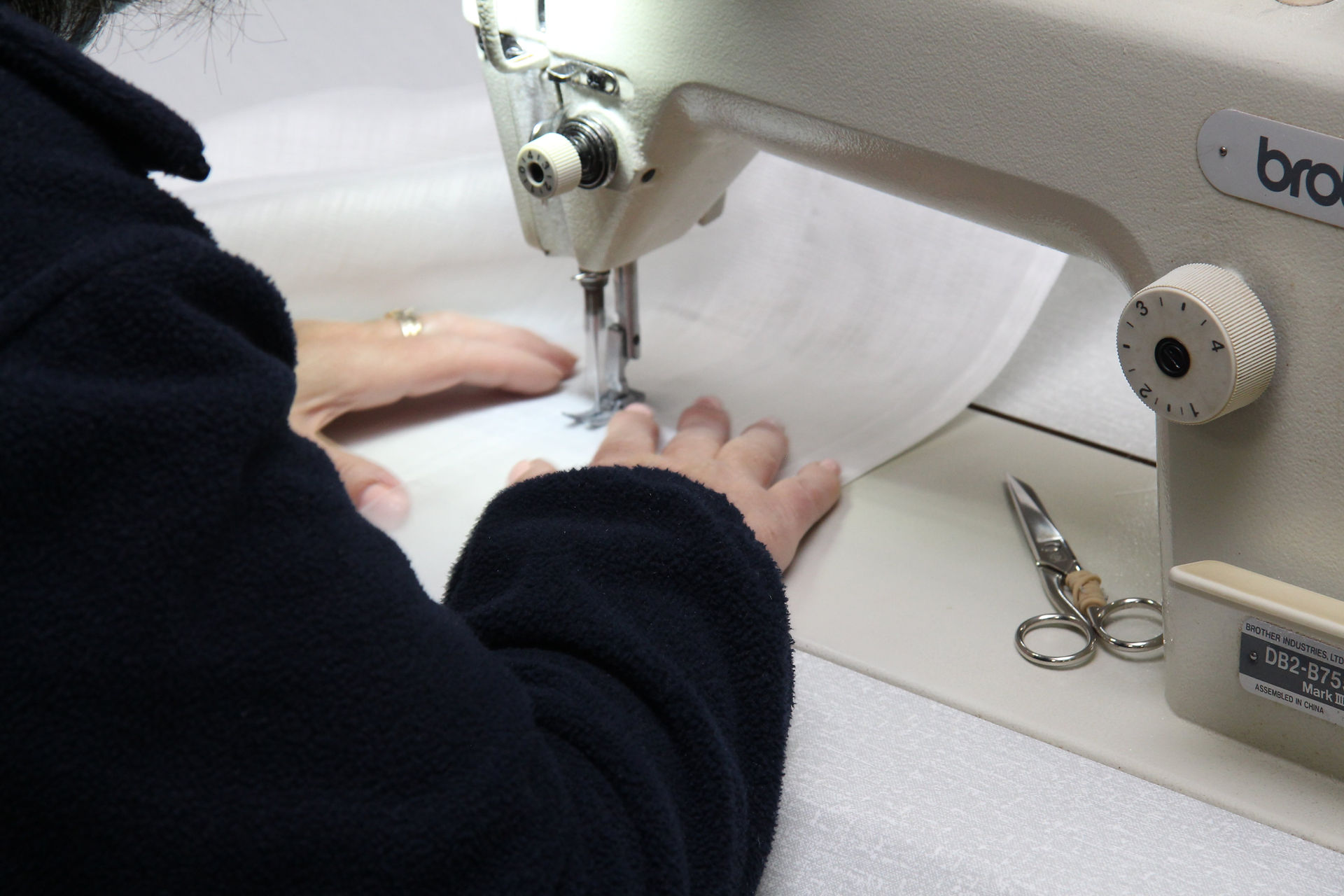 Portugal Interiors - curtains made in Portugal - seamstress making curtains on a sewing machine