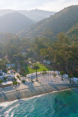 A drone image of a wedding ceremony on the lawn at Descanso Beach Club in Avalon, CA