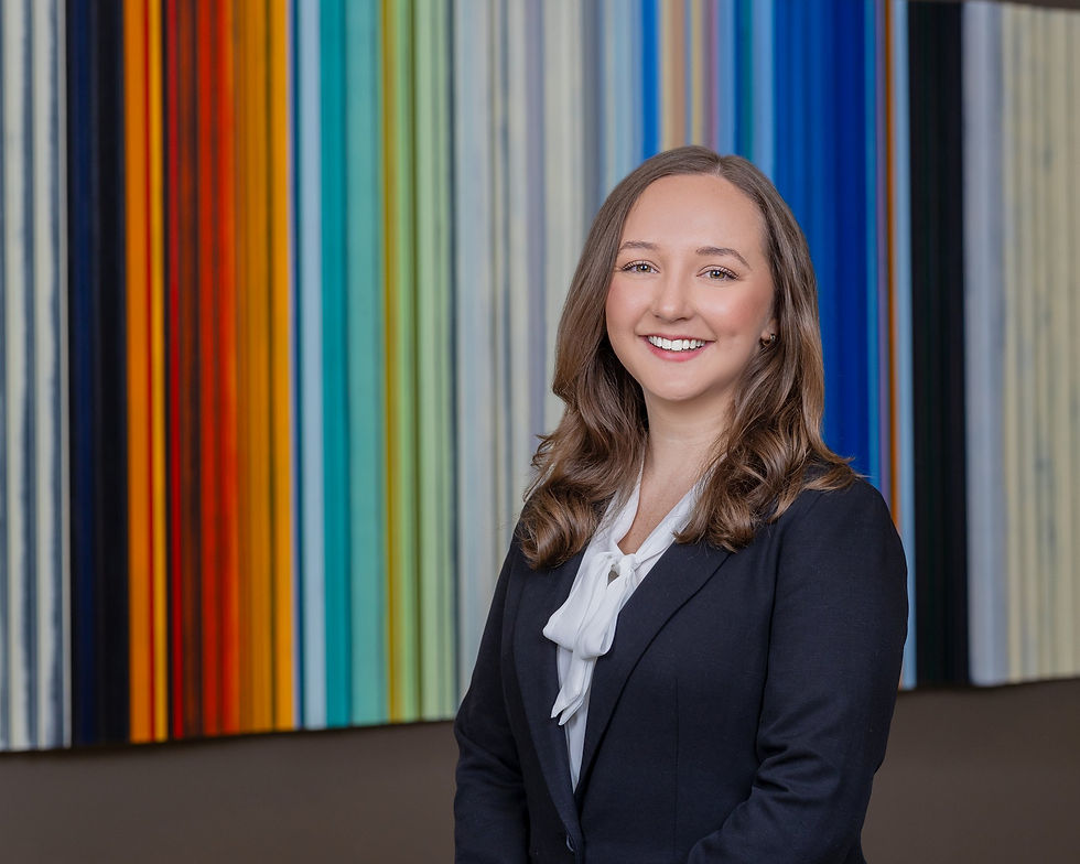 Professional headshot in front of a colorful art wall in Austin by Photography by Mesh