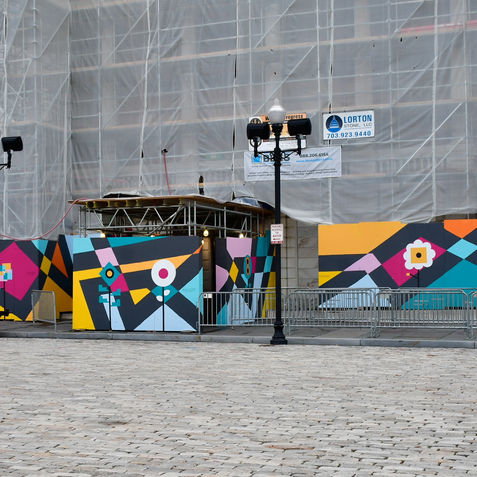 Geometric mural by WSS Fine Art at Baltimore City Hall, commissioned by the Mayor’s Office as part of the #DowntownRise initiative to enhance public spaces ahead of Artscape 2025.