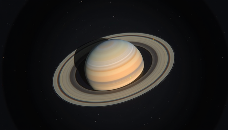 Eye-level view of Saturn with its rings visible through a telescope