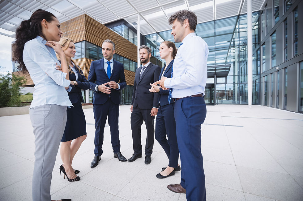 group-businesspeople-interacting-outside-office-building.jpg