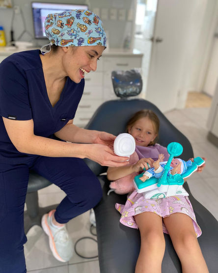 kids dentist Greenbank treating young child patient gently
