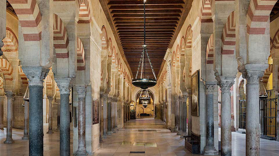 Eye-level view of the Mezquita-Catedral’s intricate arches and columns