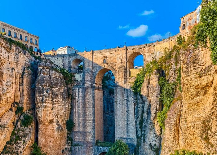 Eye-level view of Puente Nuevo bridge spanning the deep gorge in Ronda