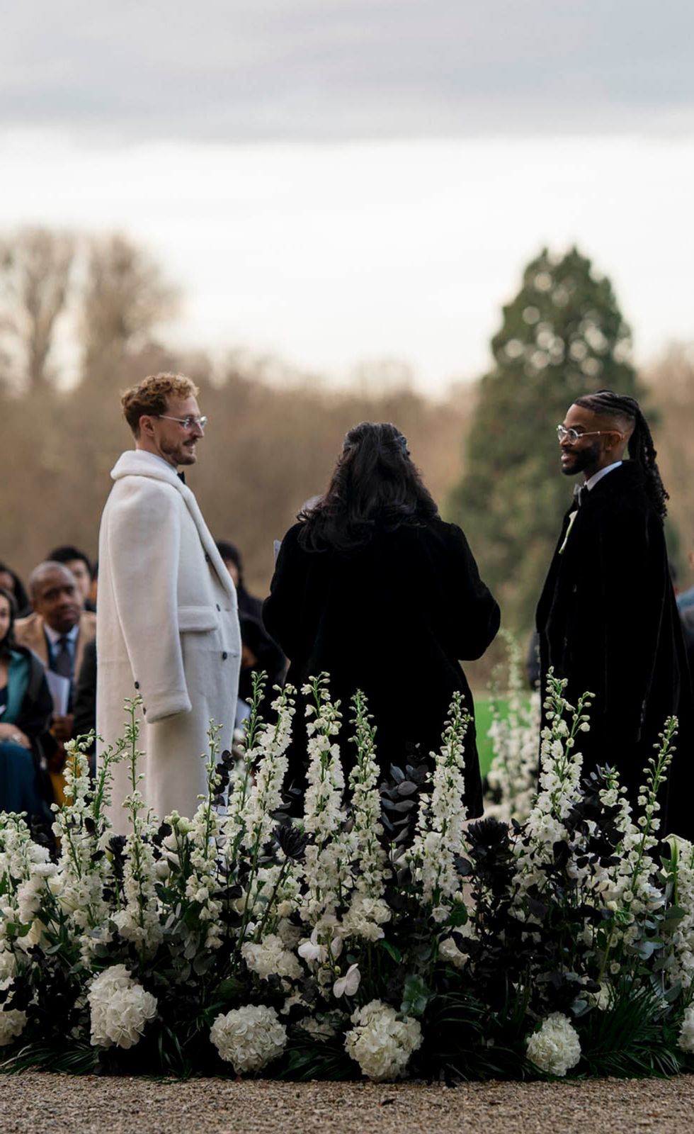 Outdoor wedding scene with elegant French château setting
