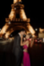 happy couple in front of eiffel tower