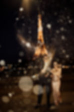 Paris Chic pre wedding photoshoot of couple pop the champagne at Pont de Bir Hakeim