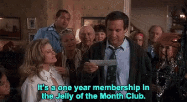 Clark Griswold in Christmas Vacation looking shocked after receiving a disappointing holiday bonus.