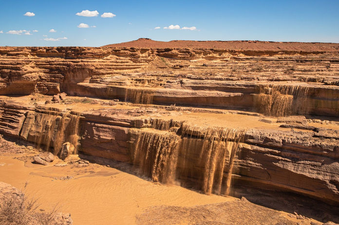 Depending on the time of year and water level, the Little Colorado River flows through Grand Falls located on the Navajo Nation outside of Flagstaff, Aug. 7, 2021. 
