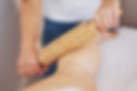 Woman at massage therapy with wooden tools.jpg