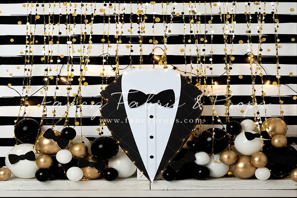 Tuxedo-themed backdrop with black-and-white stripes, gold accents, and bow-tie balloons – ideal for formal milestone sessions and first birthday photography