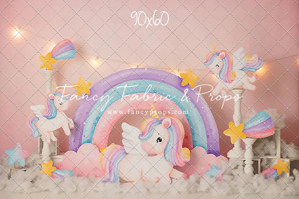 Whimsical unicorn rainbow photography backdrop with pastel clouds, stars, and ponies at Shutter Swan Studios in Lakeland, FL for magical children’s portraits
