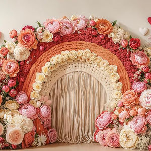 Floral rainbow cake smash backdrop with boho macramé, pink and peach roses, and heart accents – perfect for first birthday or Valentine photo sessions