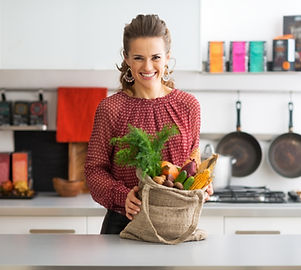 Nutritionist Smiling with a Bag of Vegetables 